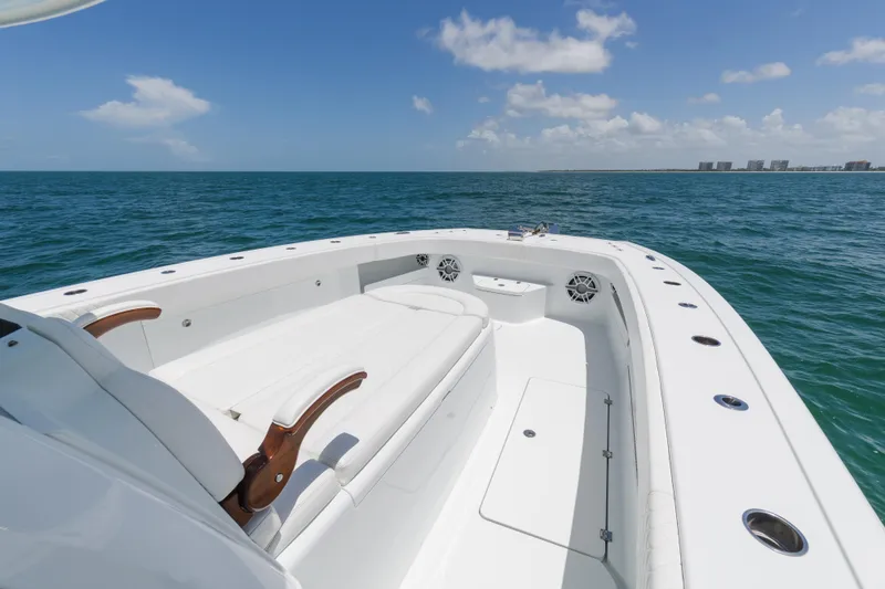 Slide: The Image of 2022 Freeman 43 boat on open sea with clear sky and distant shoreline. - 22