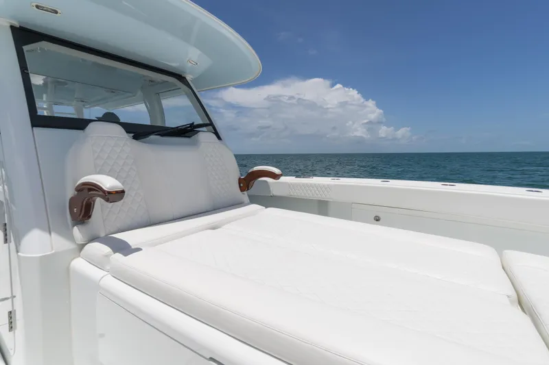 Slide: The Image of Luxurious seating on a 2022 Freeman 43 boat, with ocean view and clear skies. - 23