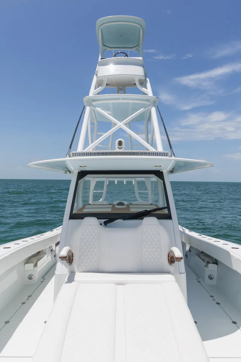 Slide: The Image of 2022 Freeman 43 boat on open sea under clear blue sky. - 24