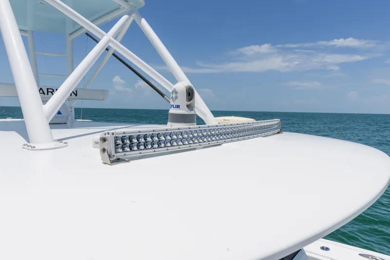 Slide: The Image of 2022 Freeman 43 boat with LED light bar on open sea under clear sky. - 25