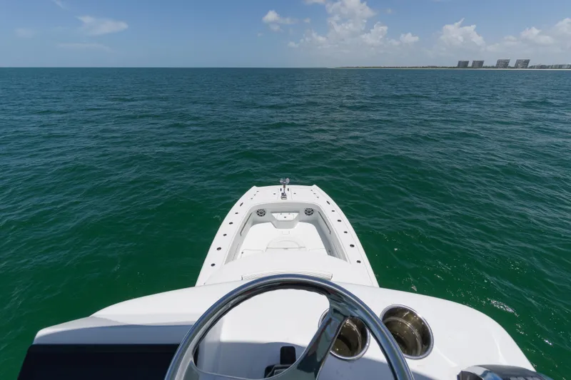 Slide: The Image of 2022 Freeman 43 boat on open sea, clear sky, distant shoreline. - 27