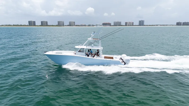 Slide: The Image of 2022 Freeman 43 boat cruising on ocean near city skyline. - 8