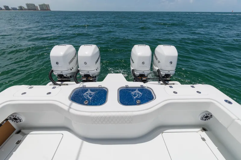 Slide: The Image of Freeman 43 boat with four Mercury outboard engines on open water, 2022 model. - 9