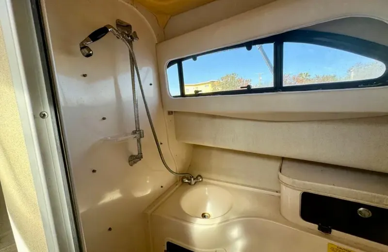 Slide: The Image of 2003 Grady-White Marlin 300 boat interior with shower and sink. - 37