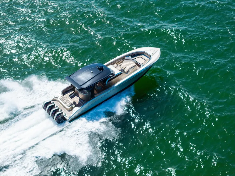 Slide: The Image of MTI V42 2021 speedboat cruising on open water, aerial view. - 10