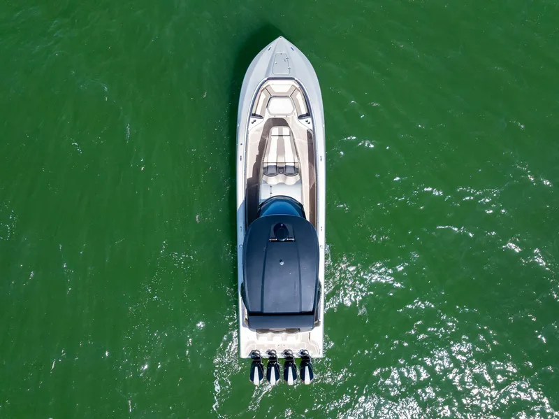 Slide: The Image of Aerial view of 2021 MTI V42 boat on green water. - 14