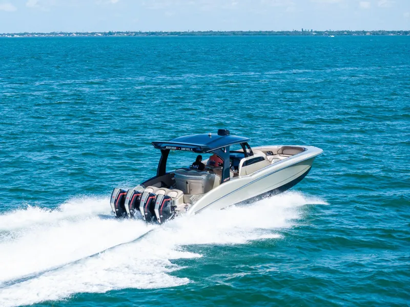 Slide: The Image of MTI V42 2021 speedboat cruising on open blue water with powerful engines. - 17