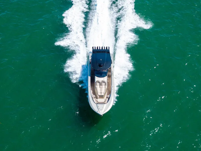 Slide: The Image of Aerial view of 2021 MTI V42 speedboat cruising on turquoise water. - 20