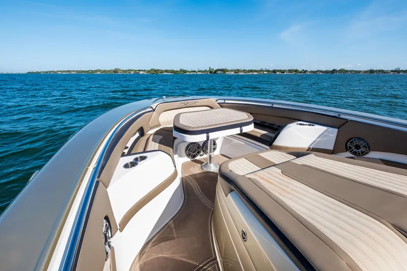 Slide: The Image of Luxury MTI V42 boat interior with beige seating, on a sunny day at sea. - 24