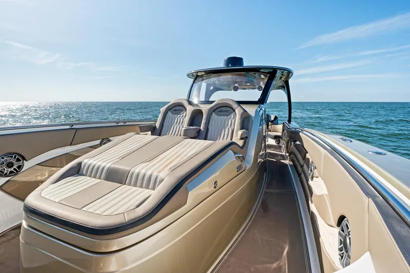 Slide: The Image of Luxurious 2021 MTI V42 boat with sleek design on open water. - 25