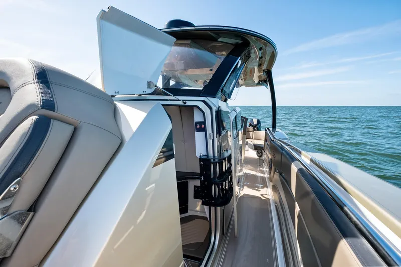 Slide: The Image of 2021 MTI V42 boat interior with open cabin door, ocean view. - 28