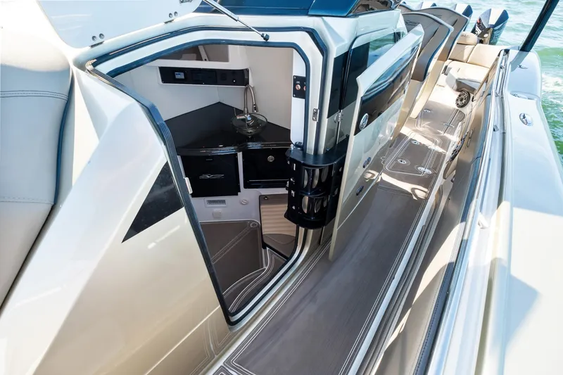 Slide: The Image of 2021 MTI V42 yacht interior with sleek design and modern amenities. - 29