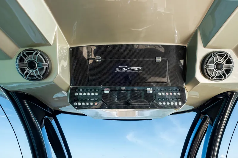 Slide: The Image of Control panel of 2021 MTI V42 boat with speakers and switches. - 39
