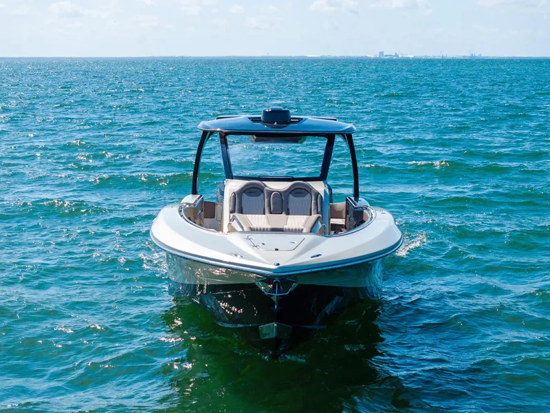 Slide: The Image of MTI V42 boat on open water, 2021 model, clear blue sky. - 4