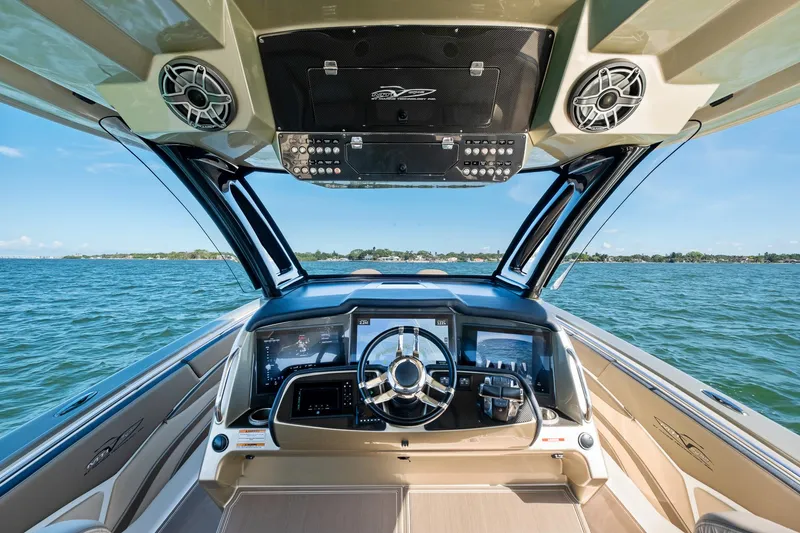 Slide: The Image of Cockpit view of 2021 MTI V42 boat with advanced navigation system on open water. - 40