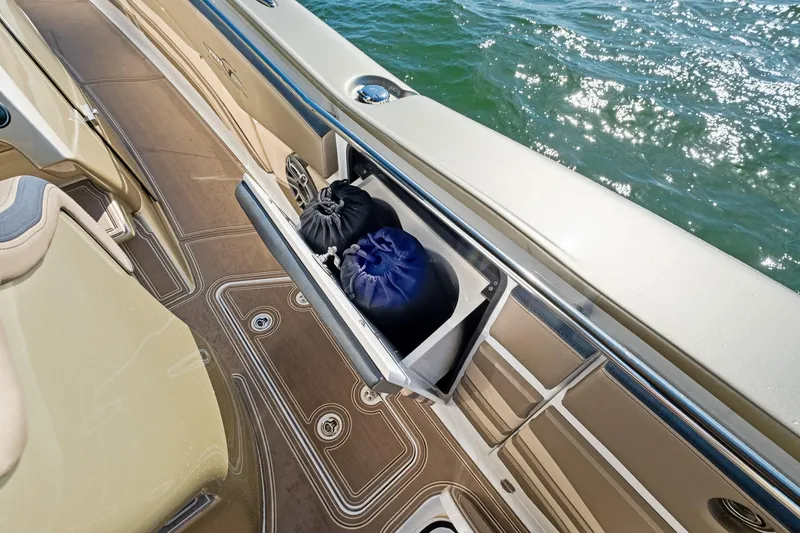 Slide: The Image of MTI V42 boat deck with storage compartment, 2021 model, on water. - 41