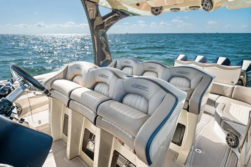 Slide: The Image of Luxurious MTI V42 boat interior with plush seating, overlooking the ocean, 2021 model. - 43