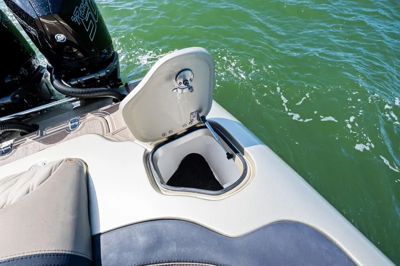 Slide: The Image of Open storage compartment on MTI V42 boat, 2021 model, near water. - 46