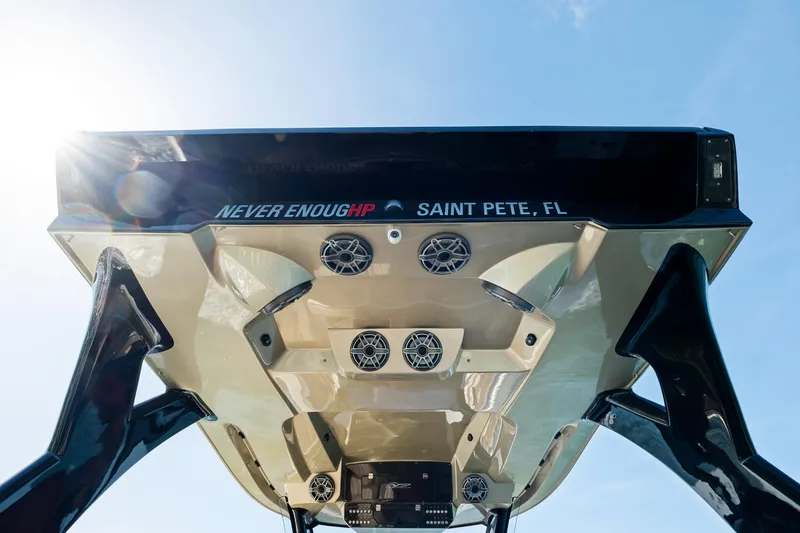 Slide: The Image of MTI V42 boat underside with speakers, "Never Enough HP" text, Saint Pete, FL, 2021 model. - 49