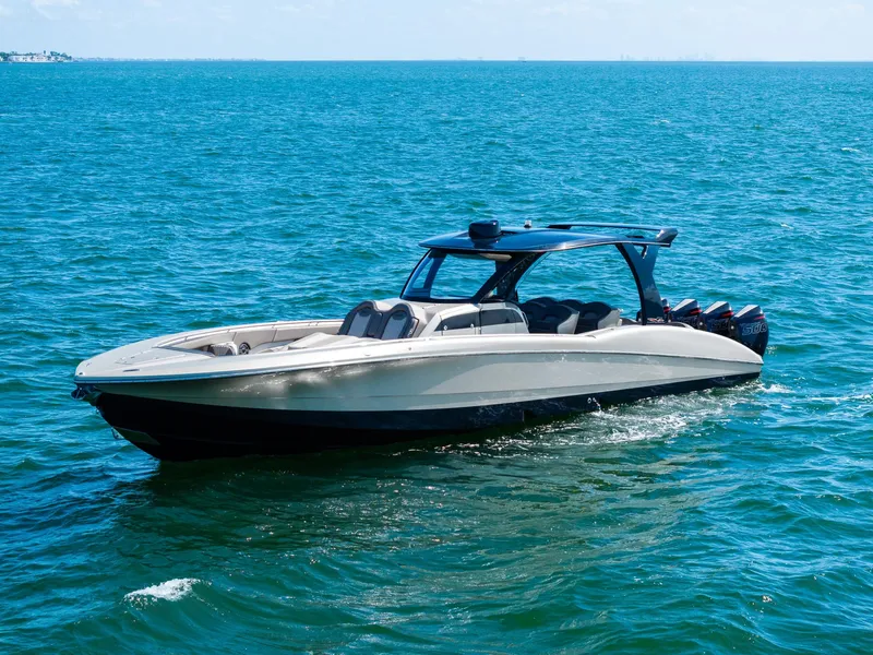Slide: The Image of 2021 MTI V42 boat cruising on clear blue ocean waters. - 7
