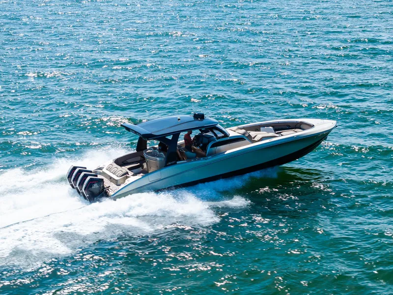 Slide: The Image of 2021 MTI V42 boat cruising on open water with powerful engines. - 9