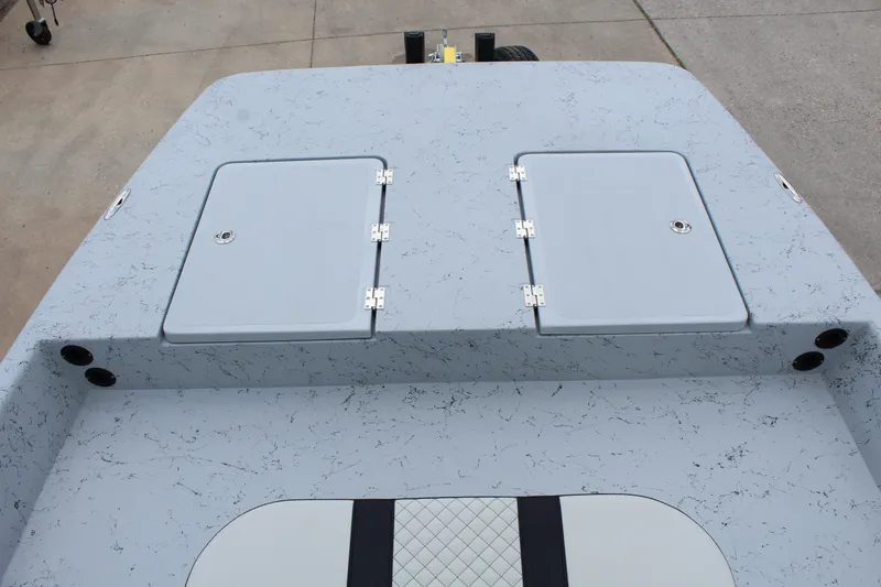 Slide: The Image of 2026 Freedom Boats EAGLE on trailer, displayed outdoors under clear blue sky. - 11