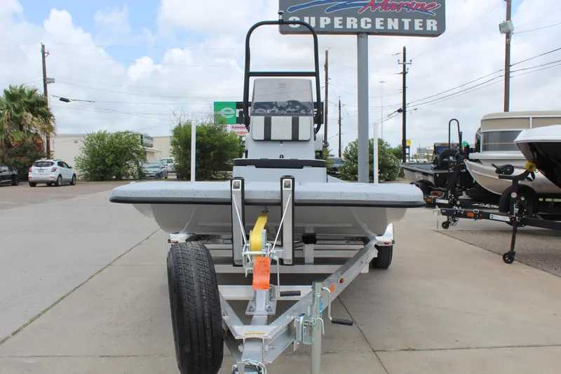 Slide: The Image of 2026 Freedom Boats EAGLE on trailer, displayed outdoors at a dealership. - 2