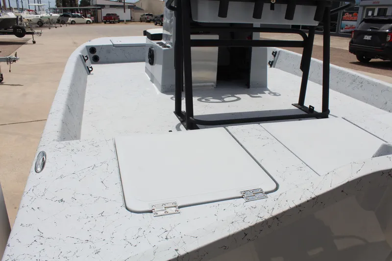 Slide: The Image of 2026 Freedom Boats EAGLE console with steering wheel and controls, parked outdoors. - 8