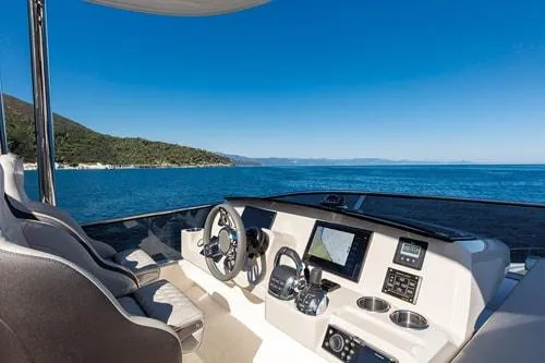 Slide: The Image of Luxurious 2023 Absolute Fly Co Ownership yacht helm with ocean view. - 16