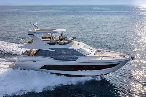 Slide: The Image of Luxury yacht cruising on open sea, Absolute Fly Co Ownership 2023 model. - 3