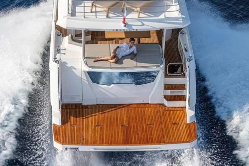 Slide: The Image of Luxury yacht cruising with person relaxing on deck, Absolute Fly Co Ownership 2023 model. - 8