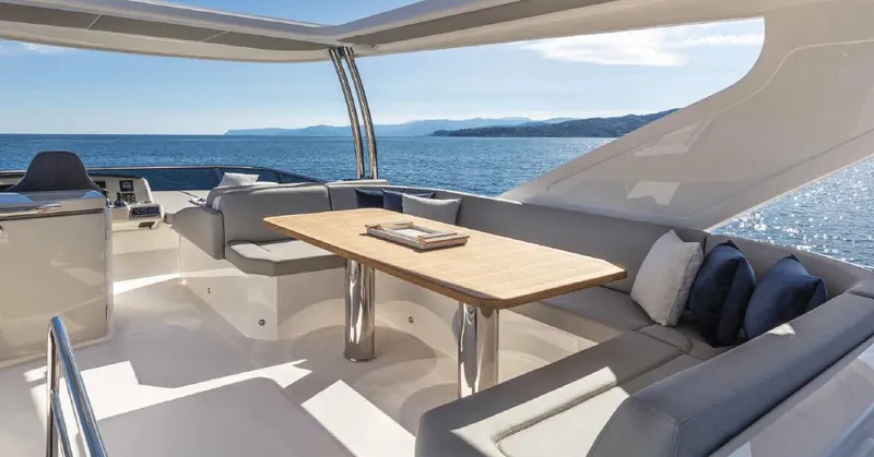 Slide: The Image of Luxurious 2023 Absolute Fly Co Ownership yacht with elegant seating and ocean view. - 11
