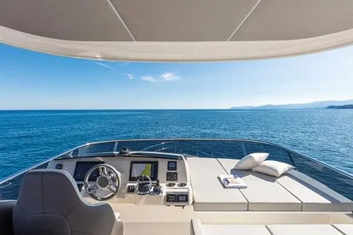 Slide: The Image of Luxurious 2023 Absolute Fly Co Ownership yacht helm with ocean view and modern controls. - 15
