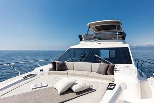 Slide: The Image of Luxury yacht Absolute Fly Co Ownership 2023 on open sea, featuring spacious deck and seating. - 20