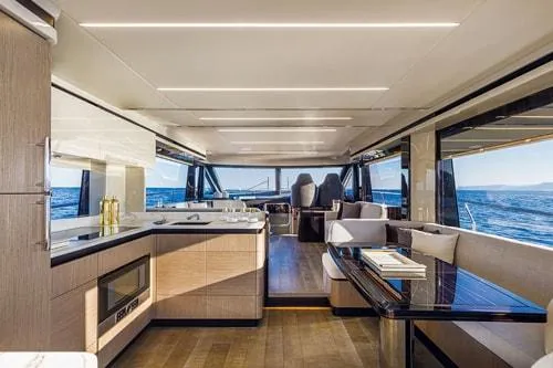 Slide: The Image of Luxurious yacht interior with modern kitchen and dining area, Absolute Fly Co Ownership 2023 model. - 23