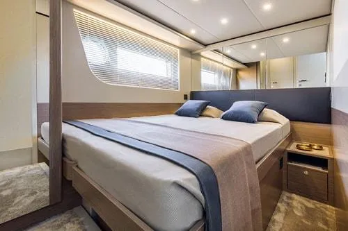 Slide: The Image of Luxurious bedroom interior on Absolute Fly Co Ownership yacht, 2023 model, featuring modern design and cozy bedding. - 33