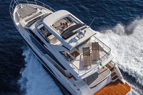 Slide: The Image of Luxurious 2023 Absolute Fly Co Ownership yacht cruising on open sea. - 6