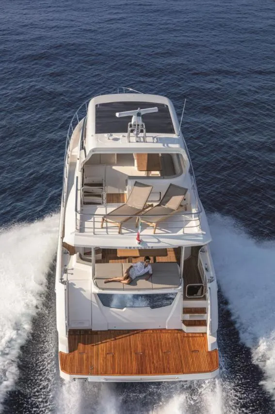 Slide: The Image of Luxury Absolute Fly Co Ownership yacht cruising on open sea, 2023 model. - 7