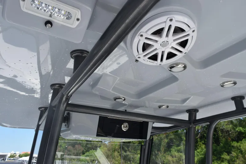 Slide: The Image of 2023 Crevalle 26 HCO boat interior ceiling with speaker and lighting fixtures. - 12
