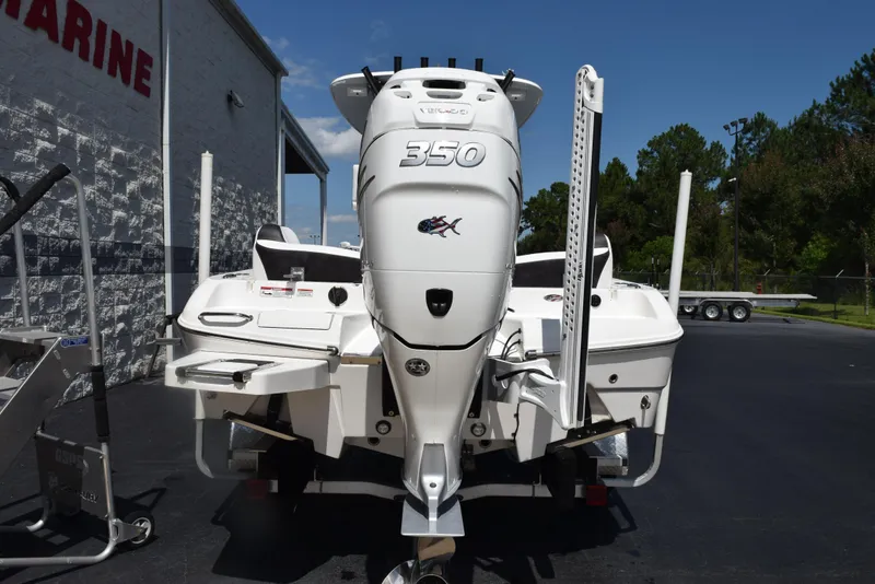 Slide: The Image of 2023 Crevalle 26 HCO boat with powerful 350 engine, parked outdoors. - 5