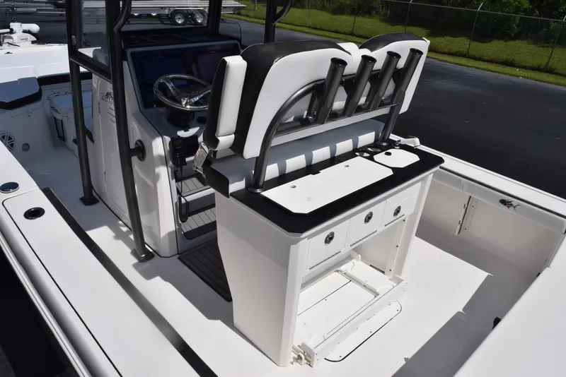Slide: The Image of 2023 Crevalle 26 HCO boat interior with helm and seating area. - 8
