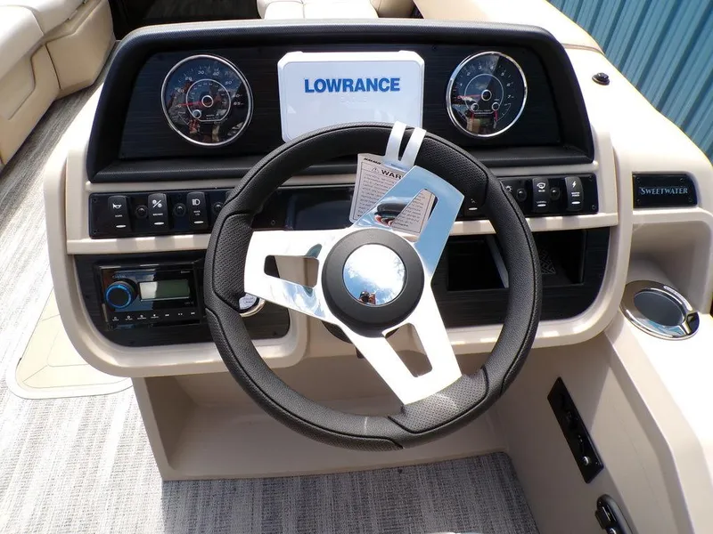 Slide: The Image of Steering console of 2025 Godfrey Sweetwater 2286 SB boat with Lowrance display. - 3