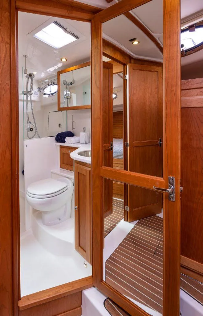 Slide: The Image of 2026 Back Cove 372 yacht bathroom with wooden cabinetry and modern fixtures. - 14