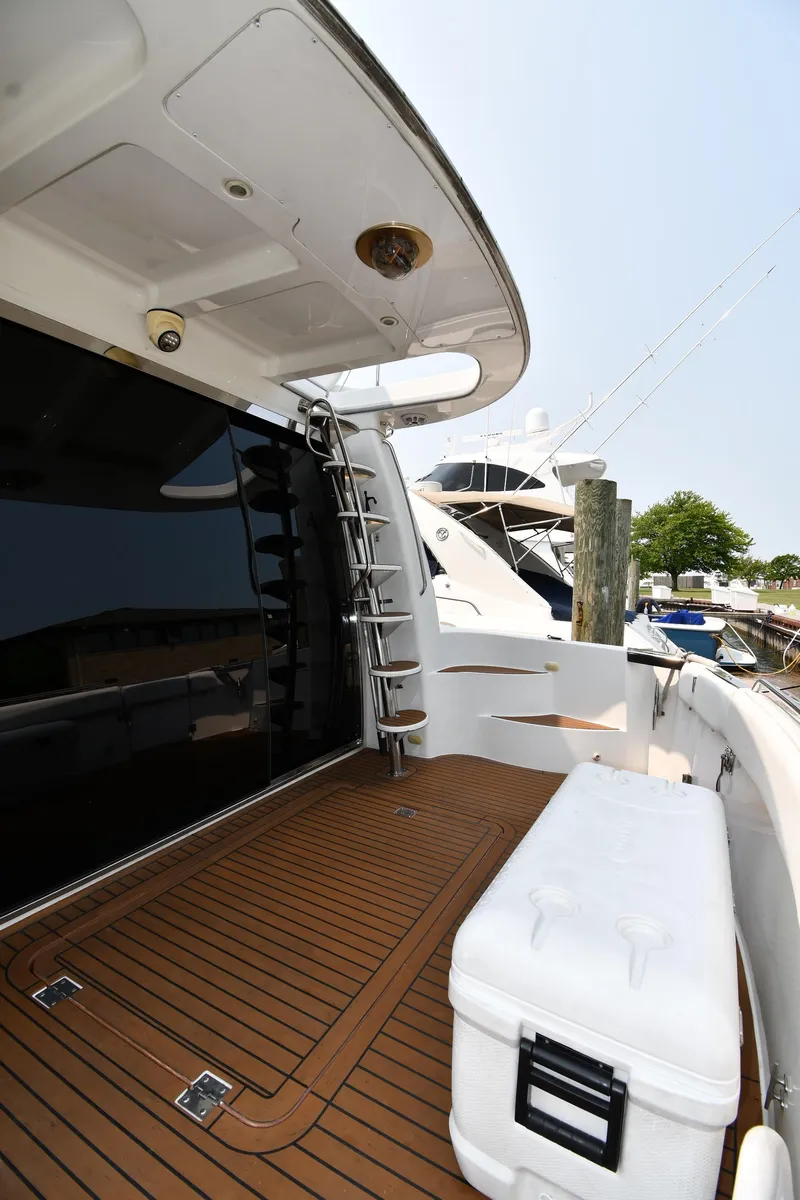 Slide: The Image of 1998 Carver 530 Voyager Pilothouse yacht with teak deck and ladder. - 10