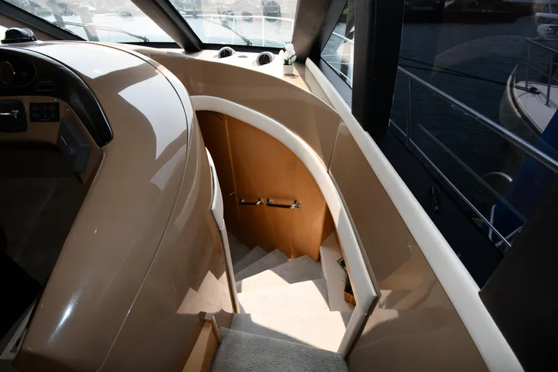 Slide: The Image of Interior staircase of 1998 Carver 530 Voyager Pilothouse yacht, featuring sleek design and natural lighting. - 35