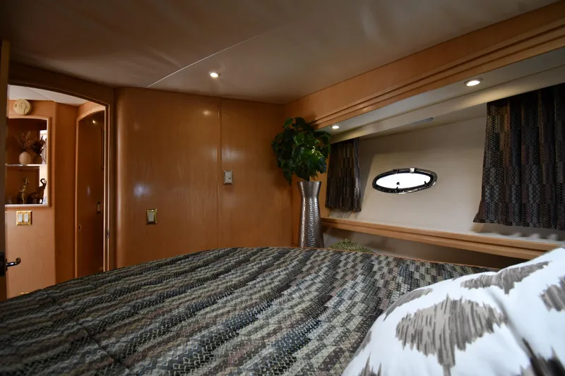 Slide: The Image of Luxurious interior of 1998 Carver 530 Voyager Pilothouse with cozy bed and elegant decor. - 42