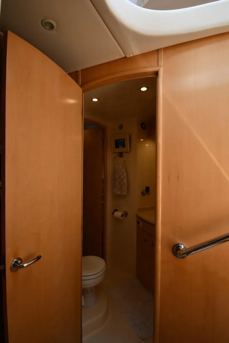 Slide: The Image of 1998 Carver 530 Voyager Pilothouse bathroom with wooden door and modern fixtures. - 46