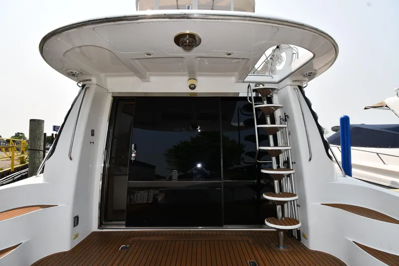Slide: The Image of 1998 Carver 530 Voyager Pilothouse yacht with wooden deck and spiral staircase. - 7