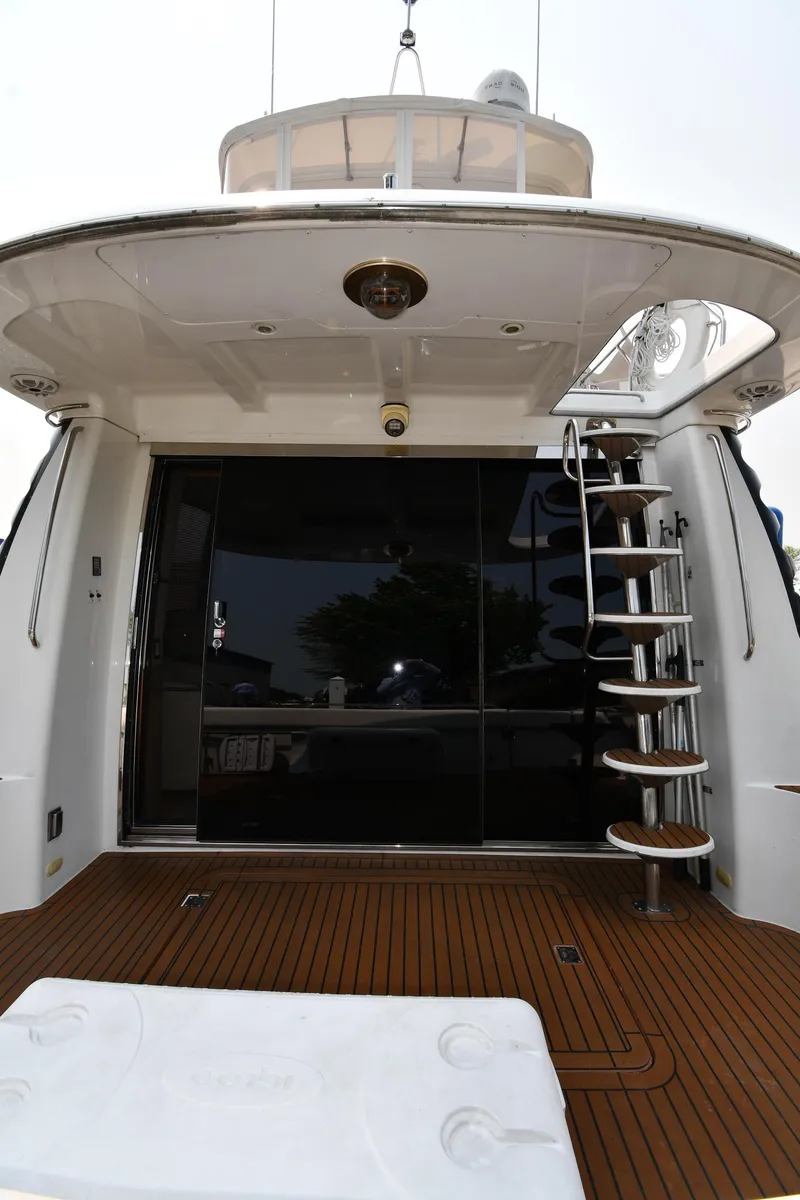 Slide: The Image of 1998 Carver 530 Voyager Pilothouse yacht with sleek design and spiral staircase. - 8