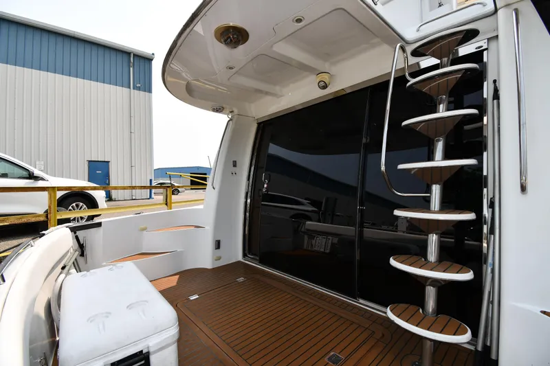 Slide: The Image of 1998 Carver 530 Voyager Pilothouse yacht with spiral staircase and teak deck. - 11